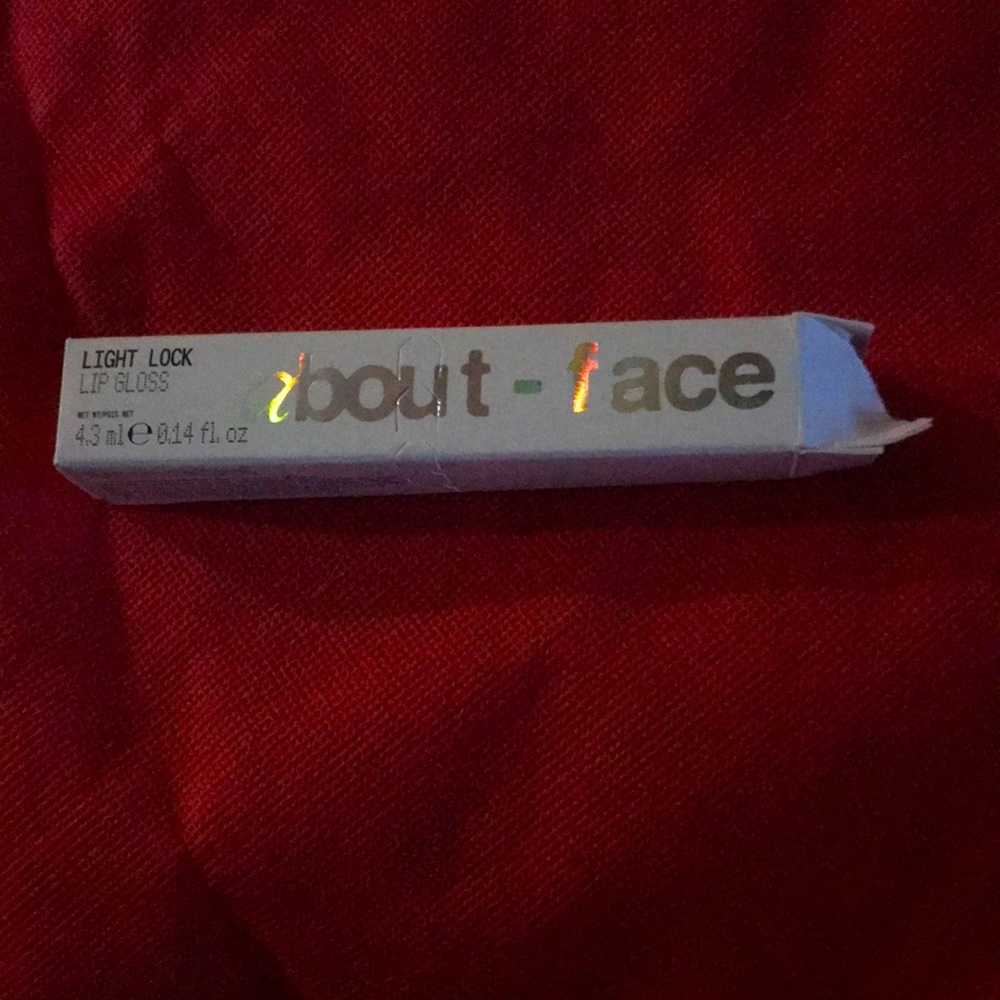 About Face light lock lip gloss